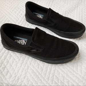 All black Vans Slip-On